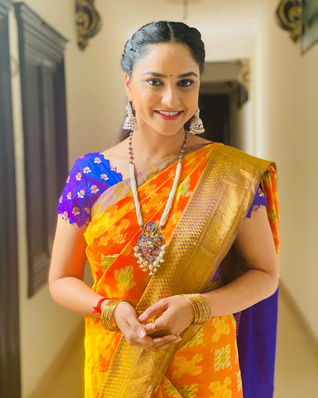 Telugu Tv Anchor Kasi Annapurna Stills in Orange Saree